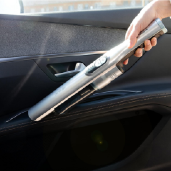 Handheld vacuum cleaner cleaning car seat interior
