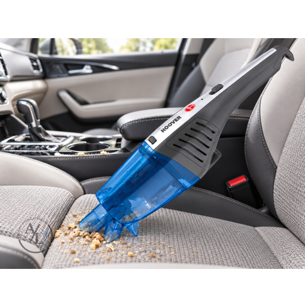 Hoover HJ72WDLB cordless handheld vacuum cleaning crumbs from a car seat