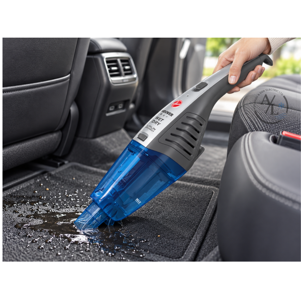 Hoover HJ72WDLB handheld wet and dry vacuum removing liquid from a car carpet
