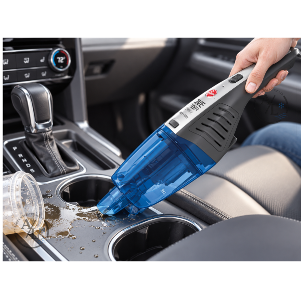 Hoover HJ72WDLB handheld wet and dry vacuum removing liquid from a car cup holder area